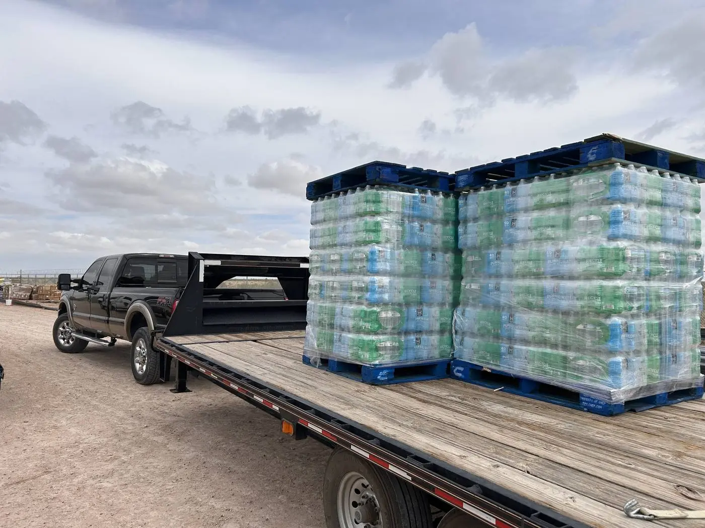 Pallets of water loaded on the delivery trailer
